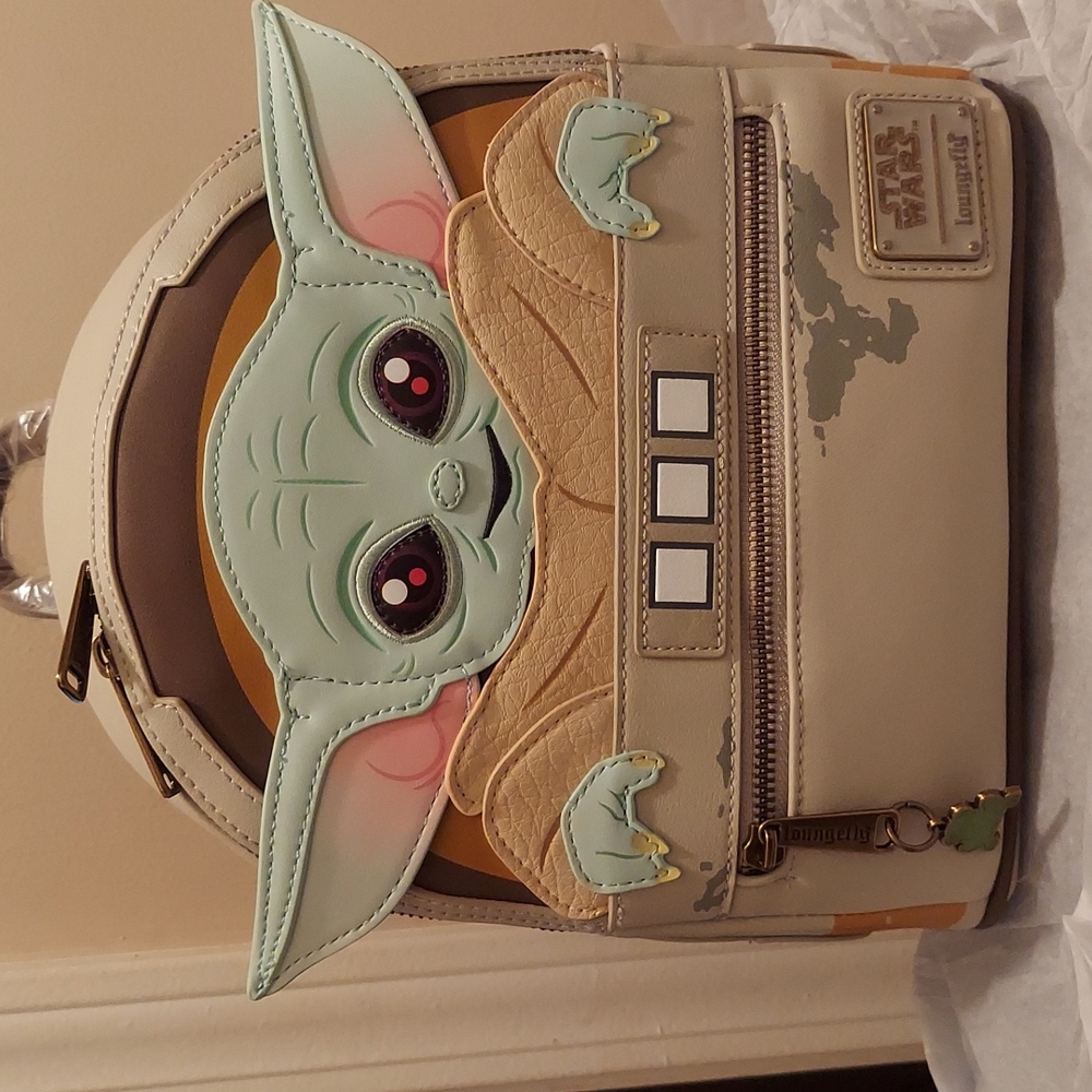 LOUNGEFLY The Child Cradle Yoda Mini Backpack.
